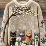 Baumwollpullover mit Katzen unter verschneitem Baum mit Schals